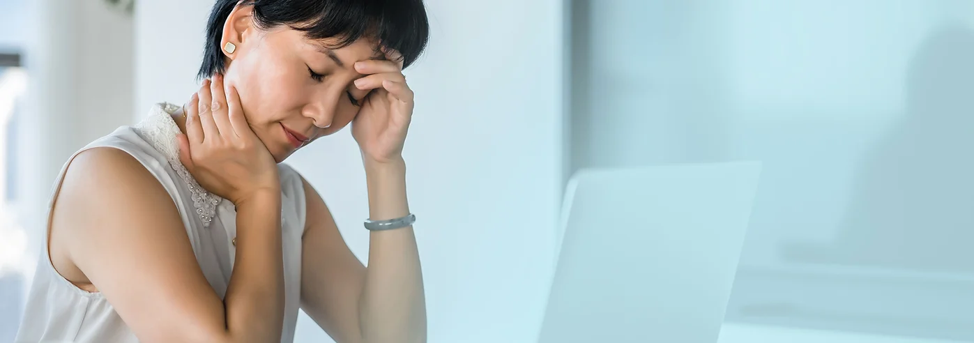 Woman appears tired at her desk